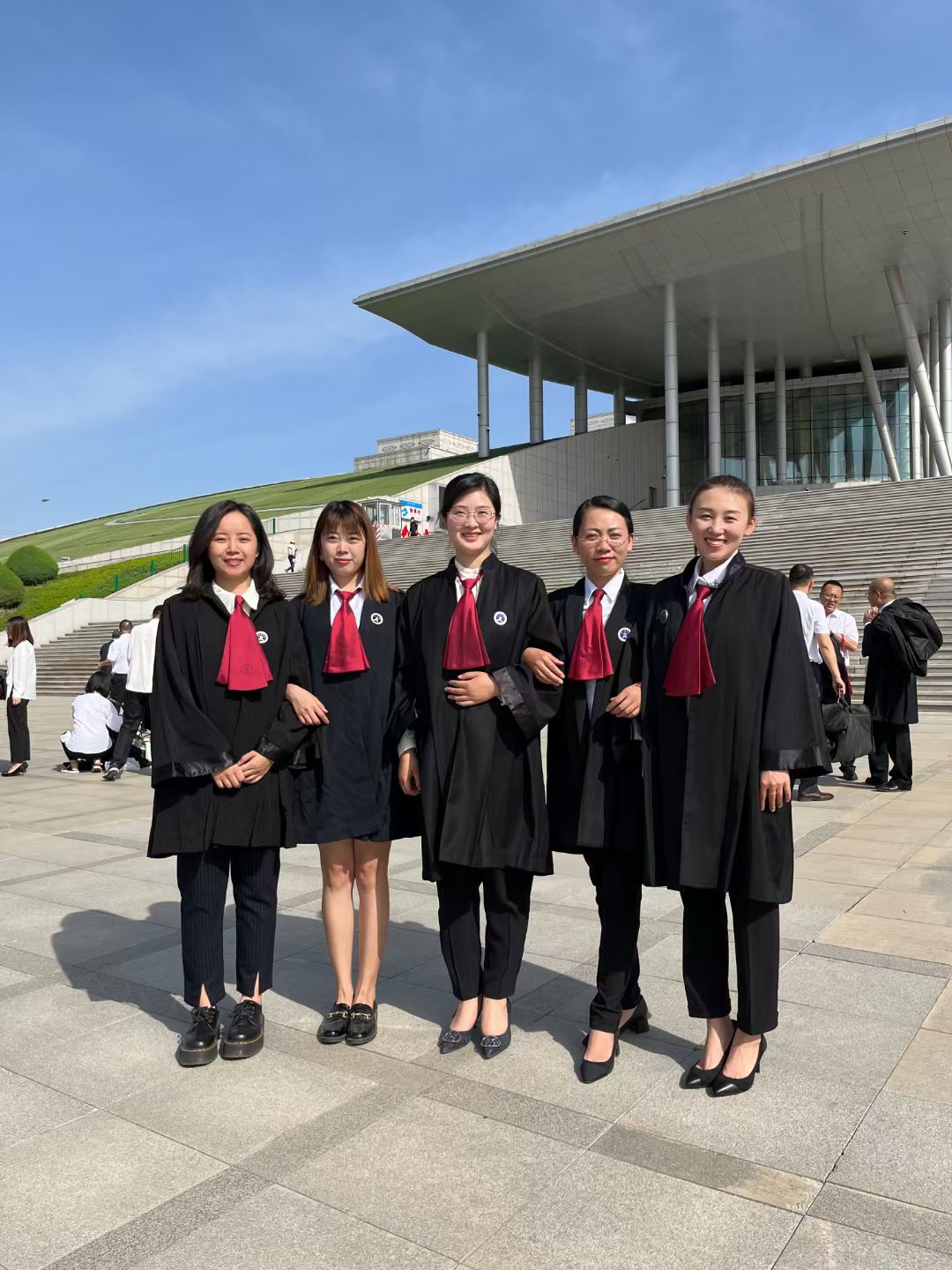In Chinese lawyers’ robes, with colleagues.